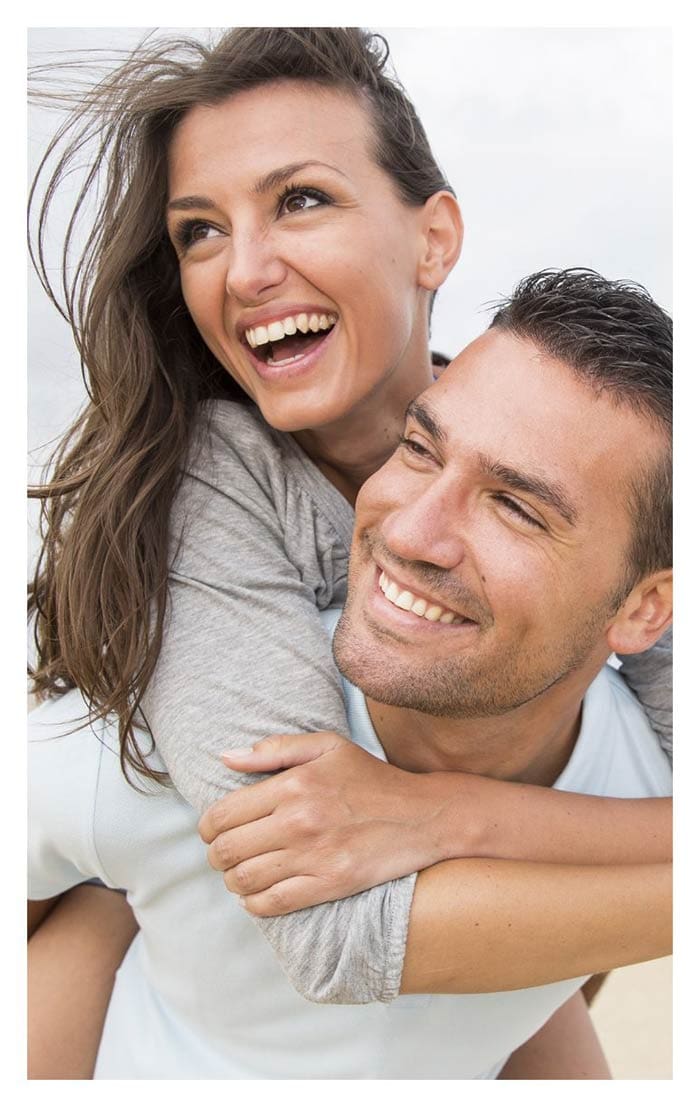 man and woman smiling