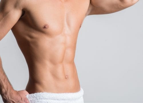 Man with no excess fat after muscle toning treatments