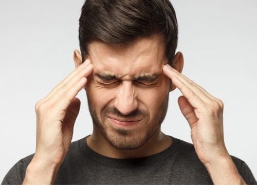 Man experiencing headaches