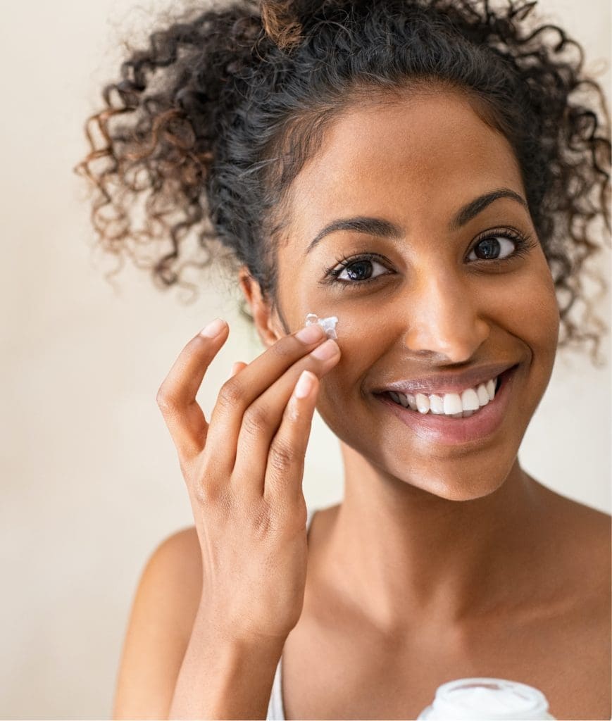 Woman applying a face cream